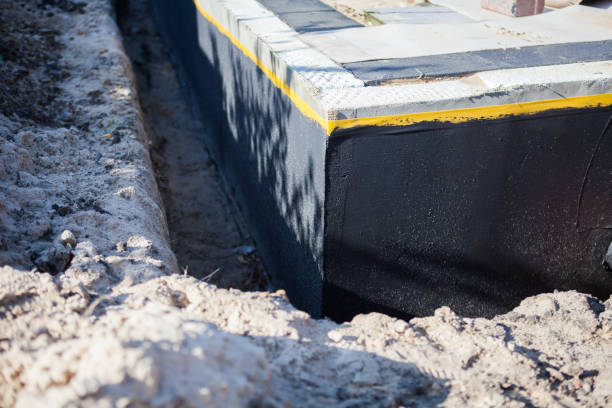 Professional Waterproofing technician working in Lake Zurich, IL